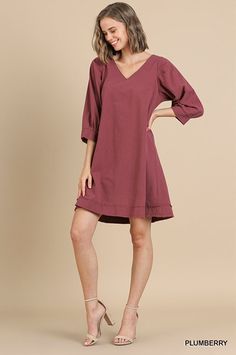 Umgee Shift A line dress, puff sleeve, V neck and frayed hem. Unlined, no pockets. Stiff linen like fabric. Color: Plumberry Sizes: S-M-L Bust 38-40-42 Length 35Our model is 5' 9" and wearing small 100% Cotton U3/A5255 Dress Puff Sleeve, Line Dress, V Neck Dress, Fabric Color, Shift Dress, A Line Dress, Puff Sleeve, Neck Dress, Knee Length