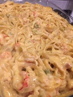 a casserole dish with noodles and vegetables in it, ready to be eaten