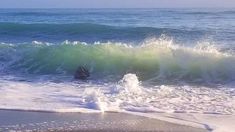 an ocean with waves crashing on the shore