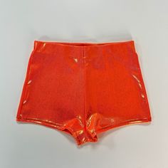 Our sahara orange booty shorts are made from our premium stretch italian lycra. The gold foiling shimmers when it catches the light. Designed with a high waist and high cut on the leg to accentuate and flatter your best bits. Handmade in England by AMY NICOLE IMPORTANT DETAILS Made to order - please allow 5-10 business days for your piece(s) to be made. If you need your order for a specific date get in touch + we can work to get it to you for that date x Orange Rave Outfit, Stella Costume, Winx Cosplay, Latex Shorts, Singer Dr, Saks Potts, Orange Pants, Last Minute Halloween Costumes, Halloween 2023