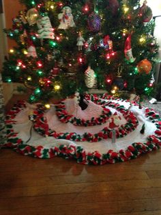 a christmas tree skirt is on the floor