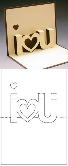 an open card with the word i love you cut out of paper and two hearts on it