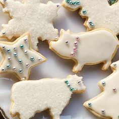 some decorated cookies are on a plate and ready to be eaten for the holiday season