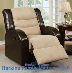 a brown recliner chair sitting on top of a carpeted floor