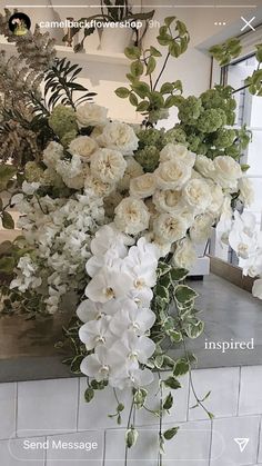 a bunch of flowers that are sitting on a counter