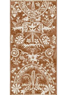 a brown and white rug with an ornate design