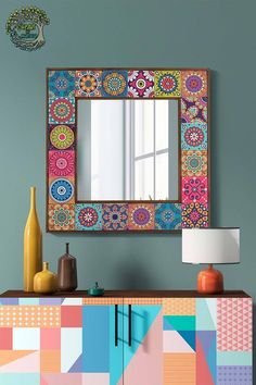 a colorful dresser with a mirror above it