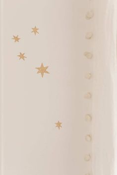 gold stars on a white wall in a room