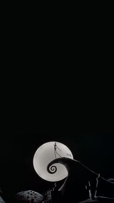 a black and white photo of a person on a surfboard in the air with a full moon behind them