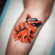 a person with a pokemon tattoo on their arm