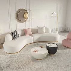 a living room filled with white furniture and lots of pillows on top of the floor