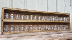 "Shot glass display - 36\" long Shot glass display is long enough to hold many sized shot glasses. Can be mounted to the wall and the hardware is included. Can also be used to hold and display essential oils. - Color shown is \"honey\" - Other options available. Add a small ledge to stop items falling off: https://www.etsy.com/listing/546553791 Add a beeswax coating: https://www.etsy.com/listing/260805496 Mounting hardware included Length: 36\" Height: 10.5\" (2 Row) Depth: 2.25\" (2\" if you ad Wall Covering Ideas Panelling, Shot Glass Display, Essential Oil Display, Barn Bar, Oil Display, Shot Glass Holder, Essential Oil Holder, Wall Light Shades, Vanity Wall Mirror