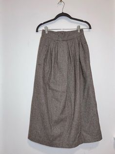 Vintage unbranded nwt maxi skirt  Wool Plaid  Zipper closure Pockets Size 4 24 inch waist Length 31.5 in  Hips 36 in  NWT excellent condition  Orange lining  Unbranded  Tags vintage 70s business corporate preppy academia broadway plaid cottage retro  Please note this item is vintage and in gently pre-owned vintage condition. Flaws as pictured and described. Vintage items have lived a previous life and may show wear, which is part of what makes them unique ** 24 Inch Waist, Plaid Midi Skirt, Skirt Wool, Preppy Academia, Womens Skirts, Wool Plaid, Vintage Wool, Waist Length, Vintage Tags