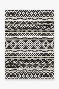 a black and white rug with geometric designs