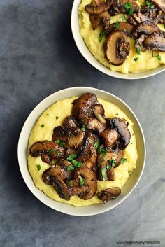 two bowls filled with mashed potatoes and mushrooms