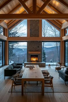 a living room filled with furniture and a fire place in the middle of a room