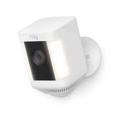 the ring security camera is mounted on a wall, with its light on it's side