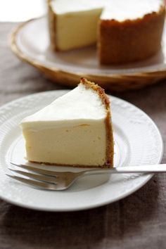 a slice of cheesecake on a plate with a fork