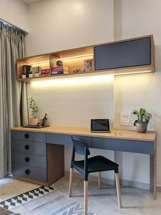 a room with a desk, chair and bookshelf on the wall above it