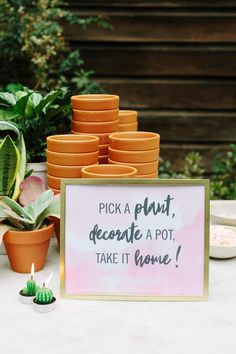 a sign that says pick a plant, decorate a pot, take it home next to some succulents