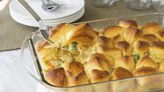 a casserole dish filled with bread and vegetables