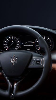 the steering wheel and dashboard of a car