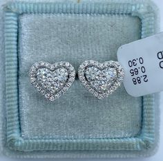 Stunning Heart Diamond Stud Earrings.  Excellent craftsmanship, the diamonds are bright and very sparkling.  The center diamonds are nice size, all set smooth.  The shape is very pretty.  Nice and solid backings for a secure fit.  These diamond studs are simply classy and beautiful.  Heart measures 10.5x9.1mm.  Genuine Diamonds total weight: 0.93 Carats  Clarity: VS/SI1 Color: F All white and shiny diamonds, no cloudy or yellowish stones  18K white gold 2.88 grams  Comes with gift box * We have been in the wholesale Jewelry business for over 30 years serving the community at the same location. All diamonds we use are natural stones and fine quality gold. Absolutely NO clarity enhanced or treated diamonds. Our jewelry pieces are handcrafted with fine craftsmanship and good quality stones. O Round Diamond Earrings For Valentine's Day, Vvs Clarity Diamond Earrings For Valentine's Day, Valentine's Day Round Diamond Earrings With Vvs Clarity, Valentine's Day Vvs Clarity Diamond Round Earrings, Vvs Clarity Diamond Heart Cut Earrings, White Diamond Heart-cut Earrings, White Diamond Heart-shaped Earrings, Luxury Heart-shaped Diamond Cut Earrings, White Diamond Heart Cut Earrings