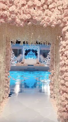 the entrance to a wedding ceremony is decorated with pink flowers