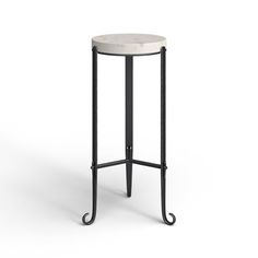 an iron and marble side table