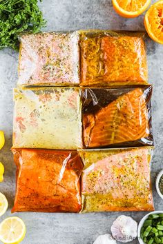 salmon fillets wrapped in cellophane with lemons, garlic and seasoning