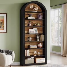 an arched bookcase in the corner of a living room