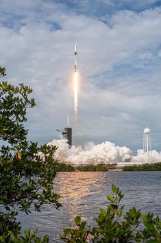 a rocket is taking off into the sky