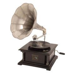 an old fashioned record player with its horn on it's stand and wind indicator