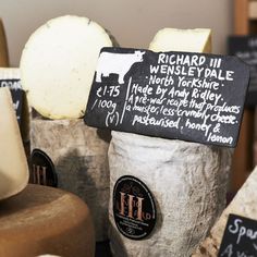 several different types of cheese are on display