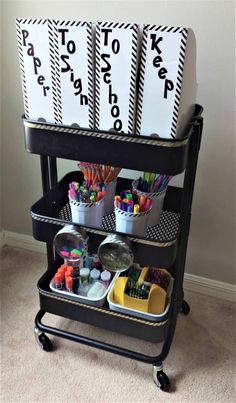 a cart filled with lots of crafting supplies on top of a carpeted floor