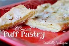 almond puff pastry on a red plate with the words almond puff pastry written below it