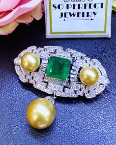 SPECTACULAR! ONE OF A KIND, ART DECO, HANDCRAFTED 18K WHITE GOLD PENDANT/BROOCH, FEATURING AN ENORMOUS 11.32 CARATS ZAMBIAN, CLASSIC EMERALD-CUT EMERALD AND TOP GRADE, SPARKLING, NATURAL, UNTREATED DIAMONDS! WITH HUGE 15 mm GOLDEN SOUTH SEA PEARL & 2 pieces of 12 mm Golden South Sea Pearls! Set in 18K solid white gold brooch! EMERALD: Weight: 11.32 carats! Vivid sweet green, with great transparency. SI1 clarity emerald. Few internal imperfections, visible but not noticeable when worn. Natura Emerald Brooch, Necklace Art Deco, Emerald Style, Golden South Sea Pearls, Pendant Brooch, White Gold Earrings Studs, Necklace Art, White Gold Necklace, Forest Green Color