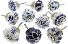 a collection of blue and white cabinet knobs with flowers on the front, back and sides