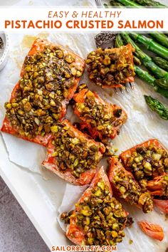 grilled salmon and asparagus on a white platter with text overlay that reads easy & healthy pistachio crusted salmon