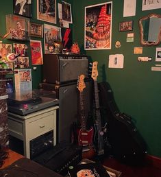 a room filled with guitars and pictures on the wall