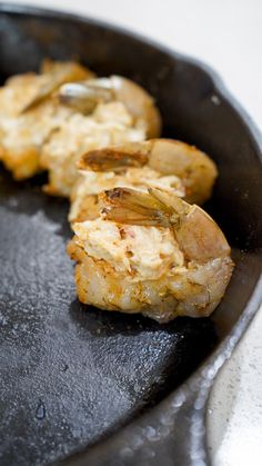 some food is cooking in a skillet on the stove top and ready to be cooked