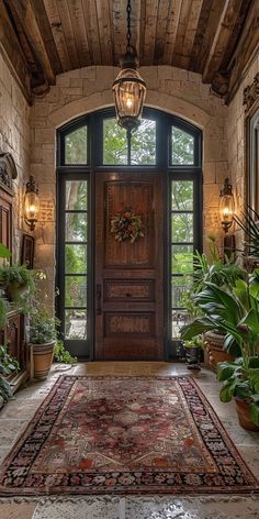 a doorway with a rug and potted plants