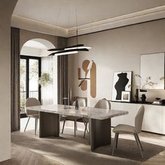 an elegant dining room with marble table and chairs