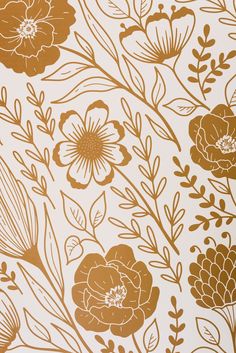 an orange and white floral wallpaper with gold foiling on the bottom half of it