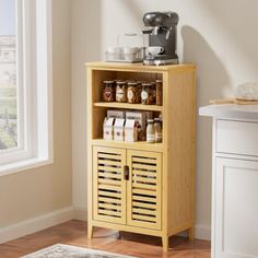 a yellow cabinet with some food on top of it and a coffee maker in the corner