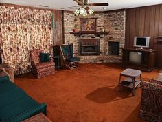 a living room filled with furniture and a fire place