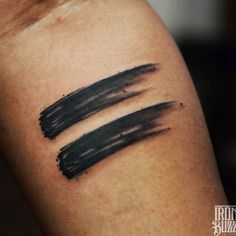 two black ink strokes on the arm