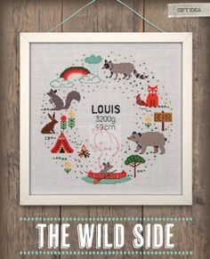 the wild side cross stitch pattern is displayed on a wooden background with text that reads, louis