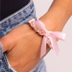 Adorable Pink Pearl Stretch Bracelet With Unique Pink Bow Ribbon Accent Feminine Adjustable Bracelets For Party, Feminine Adjustable Party Bracelets, Adjustable Feminine Party Bracelets, Elegant Pink Wristlet For Spring, Elegant Spring Wristlet, Elegant Pink Wristlet For Gift, Turquoise Silver Bracelet, Ribbon Bracelet, Ribbon Bracelets