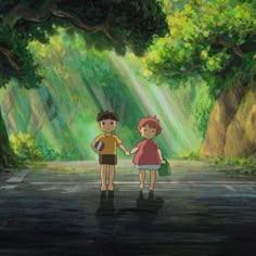 two children holding hands while standing in the middle of a road with sunlight streaming through trees